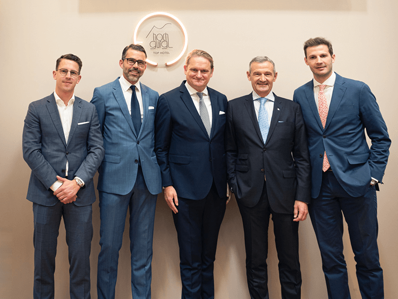 A group of men in suits at 12. 18. Investment Management GmbH