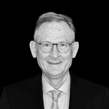 Portrait of a smiling employee in a suit.