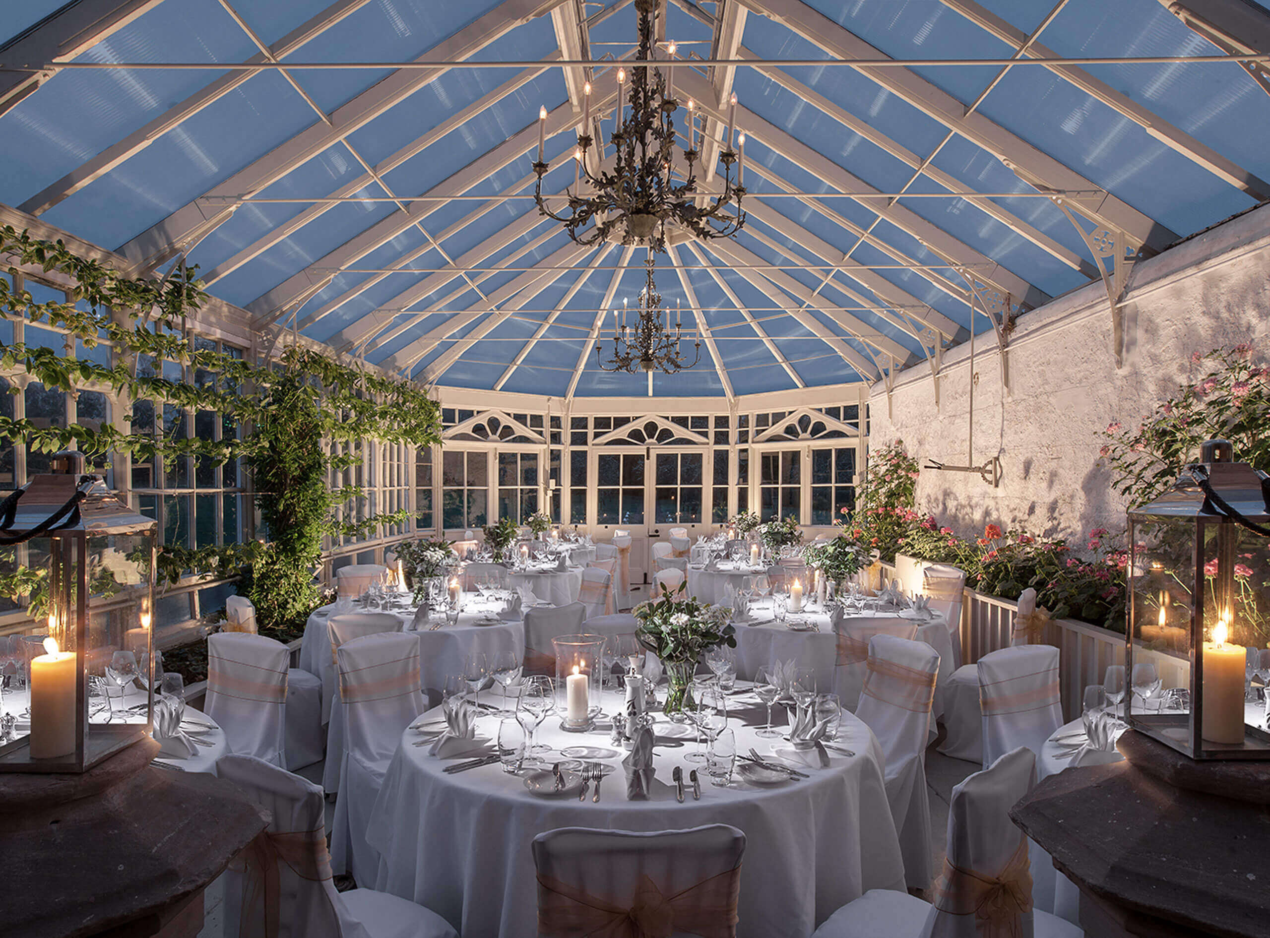 A room with tables and chairs in a restaurant or function hall