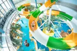 A thrilling group of people enjoying a water slide at https://12-18.com